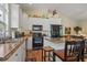 Open concept kitchen with an island and black appliances at 6001 - 1243 S Kings Hwy., Myrtle Beach, SC 29575
