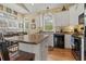 Island kitchen features granite countertops and white cabinets at 6001 - 1243 S Kings Hwy., Myrtle Beach, SC 29575
