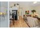 Open living room and kitchen with hardwood floors and neutral decor at 6001 - 1243 S Kings Hwy., Myrtle Beach, SC 29575