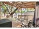 Relaxing deck with covered seating area under a large tree at 6001-Mh53 S Kings Highway, Myrtle Beach, SC 29575