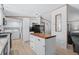 Clean and efficient kitchen with white cabinets and an island at 6001-Mh53 S Kings Highway, Myrtle Beach, SC 29575