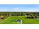 Aerial view of a home with landscaped yard surrounded by mature trees at 621 Bay St., Aynor, SC 29511