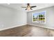 Bright bedroom features wood-look flooring and a large window at 621 Bay St., Aynor, SC 29511