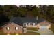 Single story home with a two-car garage and large yard at 63 Floranada Ln, Georgetown, SC 29440