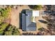 Aerial view of house, showing roofline, driveway, and surrounding land at 63 Floranada Ln, Georgetown, SC 29440