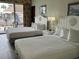 Guest room with two beds and access to a balcony at 6803 N Ocean Blvd. # 115, Myrtle Beach, SC 29572