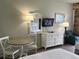 Guest room with a small table and chairs, dresser, and beds at 6803 N Ocean Blvd. # 115, Myrtle Beach, SC 29572