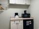 Small kitchenette with microwave, coffee maker, and mini-fridge at 6803 N Ocean Blvd. # 115, Myrtle Beach, SC 29572