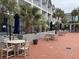 Brick patio with tables and chairs, near the pool at 6803 N Ocean Blvd. # 115, Myrtle Beach, SC 29572