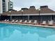 Resort-style pool with lounge chairs and patio at 6803 N Ocean Blvd. # 115, Myrtle Beach, SC 29572