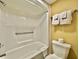 Bright bathroom with a white tub-shower combination and a standard height toilet at 6900 N Ocean Blvd. # 1234, Myrtle Beach, SC 29577