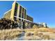Stunning exterior view of the beachfront condo complex and well manicured beach at 6900 N Ocean Blvd. # 1234, Myrtle Beach, SC 29577