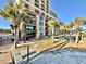 Lovely view of the condo complex, landscaping, and a walkway to the beach at 6900 N Ocean Blvd. # 1234, Myrtle Beach, SC 29577