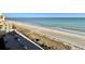 Expansive view of the sandy beach and ocean from the condominium's balcony at 6900 N Ocean Blvd. # 1234, Myrtle Beach, SC 29577
