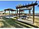 Grassy picnic area with shaded pergolas and beach views at 6900 N Ocean Blvd. # 1234, Myrtle Beach, SC 29577