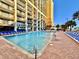 Large outdoor swimming pool and sun loungers for resident's enjoyment at 6900 N Ocean Blvd. # 1234, Myrtle Beach, SC 29577
