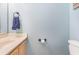 Clean bathroom with light wood vanity and a toilet at 775 Plantation Dr. # 48, Little River, SC 29566