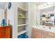 Bathroom with sink, vanity, shelves, and linen closet at 775 Plantation Dr. # 48, Little River, SC 29566