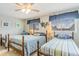 Guest bedroom with three twin beds, and ceiling fan at 775 Plantation Dr. # 48, Little River, SC 29566
