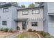 Front view of townhouse with landscaping and entrance at 775 Plantation Dr. # 48, Little River, SC 29566