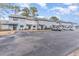 Exterior view of townhouses with parking and landscaping at 775 Plantation Dr. # 48, Little River, SC 29566