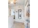 Bright hallway with mirror and access to bedrooms at 775 Plantation Dr. # 48, Little River, SC 29566