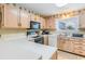 Bright kitchen features ample cabinetry, modern appliances, and a breakfast bar at 775 Plantation Dr. # 48, Little River, SC 29566