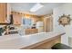 Well-equipped kitchen boasts light wood cabinets, and a breakfast bar at 775 Plantation Dr. # 48, Little River, SC 29566