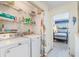 Convenient laundry room with washer, dryer, and storage shelves at 775 Plantation Dr. # 48, Little River, SC 29566