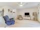 Living room with recliner, TV stand, and carpeted floors at 775 Plantation Dr. # 48, Little River, SC 29566
