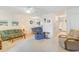 Spacious living room with seating, access to kitchen and patio at 775 Plantation Dr. # 48, Little River, SC 29566