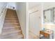 Carpeted staircase and hallway with storage at 775 Plantation Dr. # 48, Little River, SC 29566