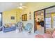 Sunroom with seating area and view of the kitchen at 775 Plantation Dr. # 48, Little River, SC 29566