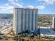 Aerial view of a high-rise building with oceanfront location and pool at 8500 Margate Circle # 606, Myrtle Beach, SC 29572