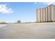 Wide sandy beach with footprints and ocean view, near high rise building at 8500 Margate Circle # 606, Myrtle Beach, SC 29572