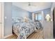 Guest bedroom with two twin beds, ocean view, and light blue walls at 8500 Margate Circle # 606, Myrtle Beach, SC 29572