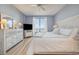 Ocean view bedroom with a king-size bed and light colored dresser at 8500 Margate Circle # 606, Myrtle Beach, SC 29572