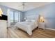 Bedroom with ocean view, king bed, and light wood floors at 8500 Margate Circle # 606, Myrtle Beach, SC 29572