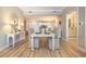 Elegant dining room with white table and chairs, hardwood floors at 8500 Margate Circle # 606, Myrtle Beach, SC 29572
