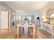 Bright dining room features a white table with seating for six and hardwood floors at 8500 Margate Circle # 606, Myrtle Beach, SC 29572
