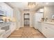 Well-equipped kitchen boasts white cabinetry, modern appliances, and a laundry closet at 8500 Margate Circle # 606, Myrtle Beach, SC 29572