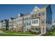 Row of charming 3-story townhouses with gray, blue, and brown siding at 8579 Balmy Breeze Pl. # 43, Myrtle Beach, SC 29572