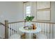 Open landing with a small table and artwork at 8579 Balmy Breeze Pl. # 43, Myrtle Beach, SC 29572