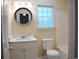 Clean bathroom with white vanity and block glass window at 9215 Greeneedle Pl., Murrells Inlet, SC 29576