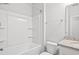 A bright bathroom features a shower-tub combination and granite countertop vanity at 10 Grace Bay Ct., Pawleys Island, SC 29585