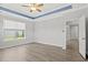 Bright bedroom with trey ceiling, natural light, and neutral paint at 10 Grace Bay Ct., Pawleys Island, SC 29585