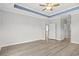 Bedroom with trey ceiling, hardwood flooring, and neutral paint at 10 Grace Bay Ct., Pawleys Island, SC 29585