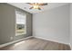 Bedroom with modern ceiling fan, and a view of the front yard at 10 Grace Bay Ct., Pawleys Island, SC 29585