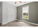 Bedroom with large closet and a window with a view of the neighborhood at 10 Grace Bay Ct., Pawleys Island, SC 29585