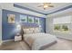 Stylishly furnished main bedroom with trey ceiling, natural light, and modern furnishings at 10 Grace Bay Ct., Pawleys Island, SC 29585